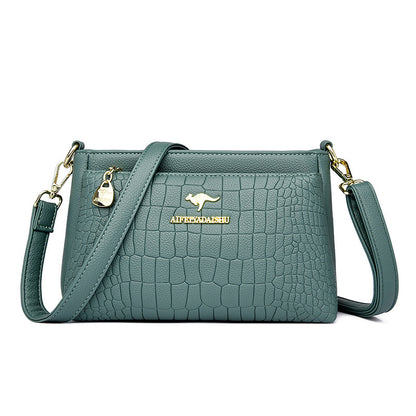 Green textured crossbody purse for every occasion with adjustable strap and gold accents