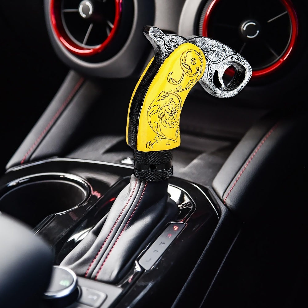 Custom resin gear shift knob in yellow with intricate designs for enhanced car modifications