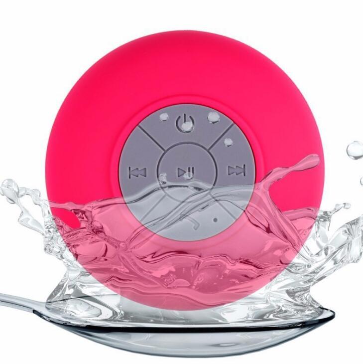 Sheila Merchandise mini waterproof Bluetooth speaker in pink with water splash on a spoon