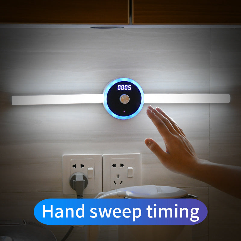 Motion sensor cabinet lighting with clock and timing features activated by hand gesture