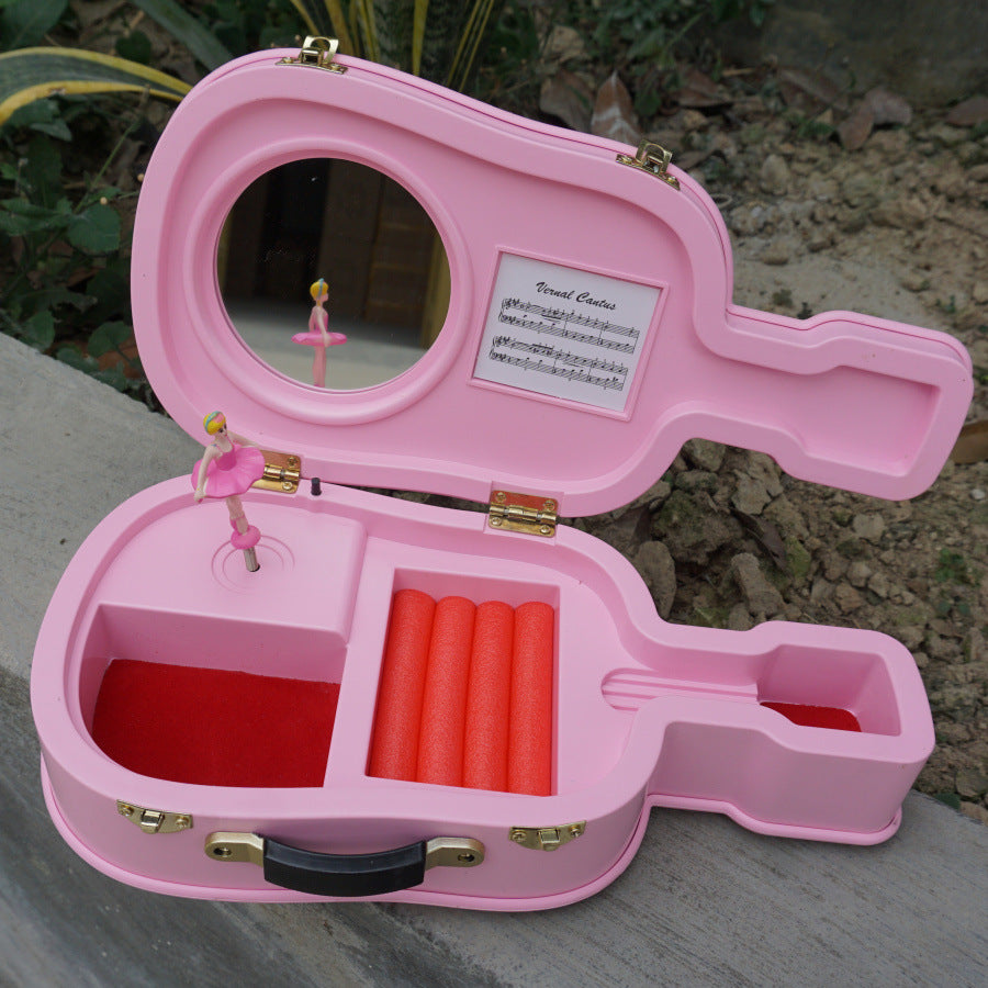 Pink musical ballet dancer box shaped like a guitar with a ballerina figure and mirror inside