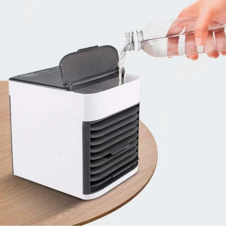 Sheila Merchandise portable air conditioner fan desktop unit with water being poured into the tank