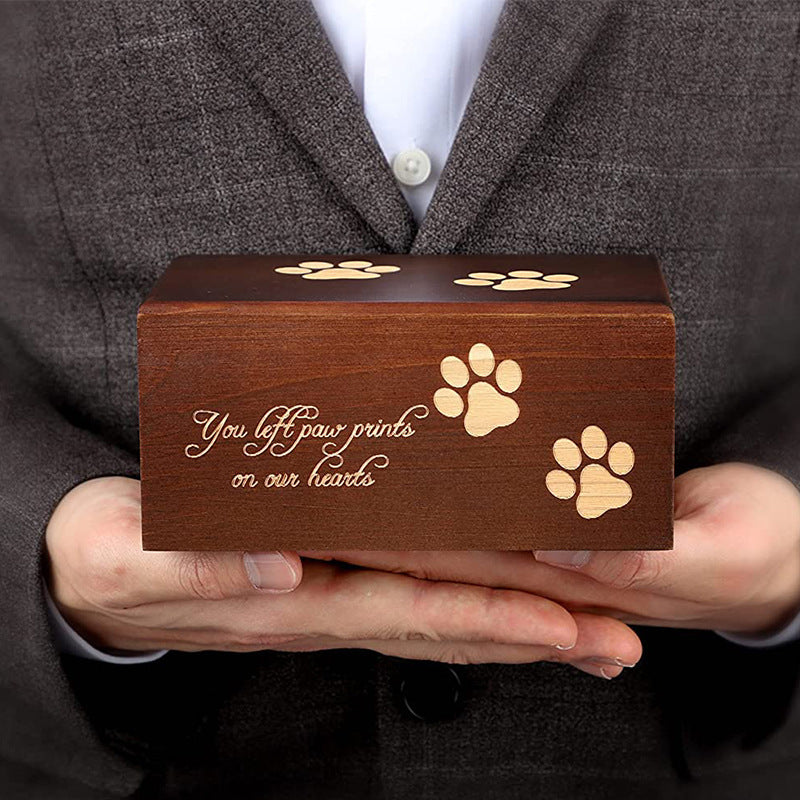 Wooden pet urn for ashes with paw prints and You left paw prints on our hearts engraving